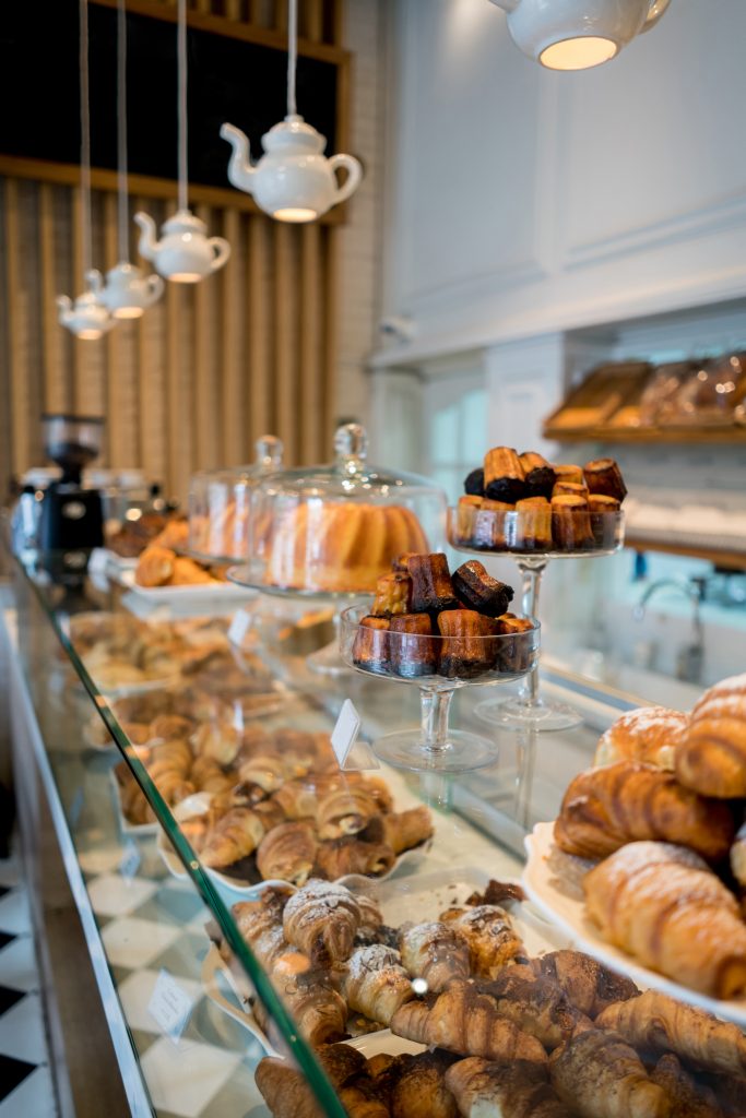 View of various delicious pastries displayed at a bakery showcasing fresh, handcrafted baked goods