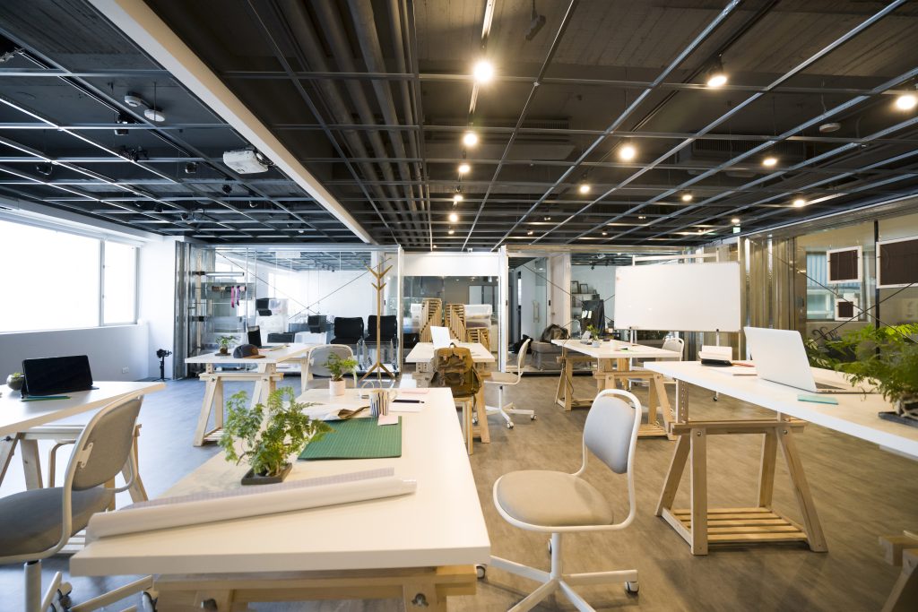 Clean and bright empty office with office equipment, ready for workers to begin their day